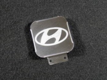 1 249 р. Заглушка на фаркоп с логотипом Hyundai (на фаркопы TCC, нержавеющая сталь) TCC  Hyundai Creta GS - Tucson 4 NX4. Увеличить фотографию 1